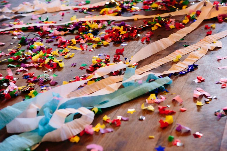 Confetti and streamers strewn across the floor