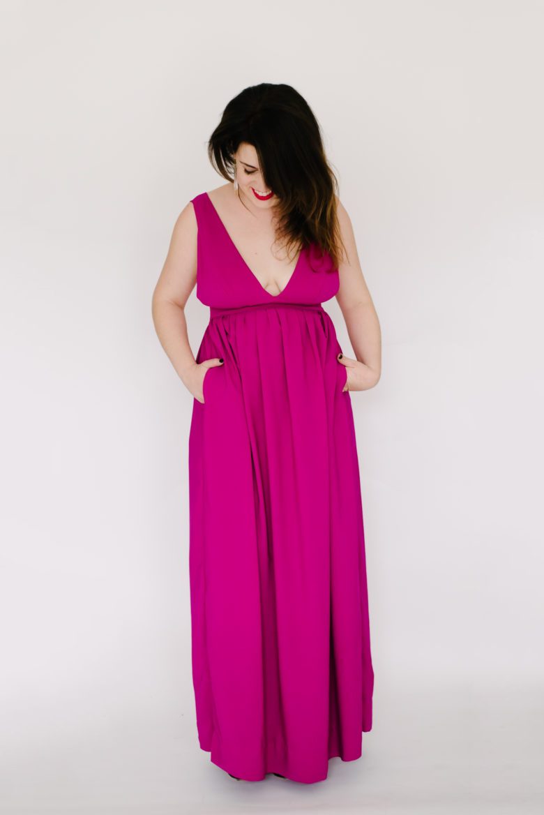 woman in long deep v pink dress