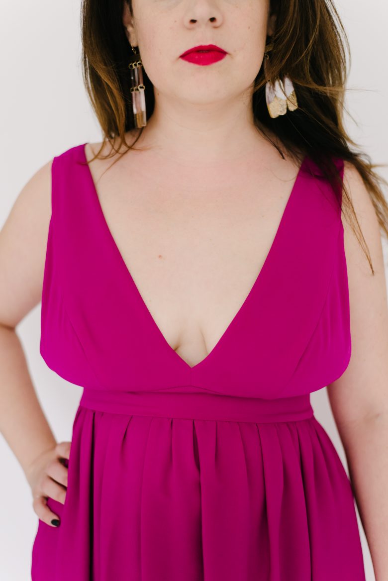 closeup of deep v neckline in pink dress