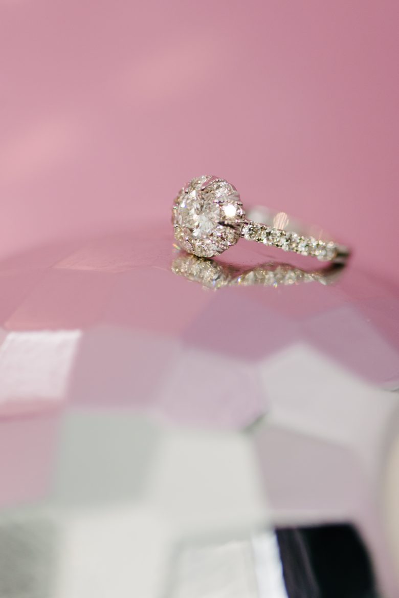 macy's star signature diamond engagement ring sitting on a disco ball