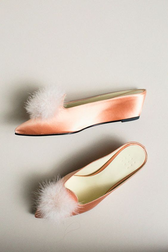 peach shoes with furry tuft on the top