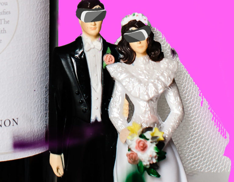 vintage bride and groom cake topper with digitally imposed VR headsets, in front of a pink background