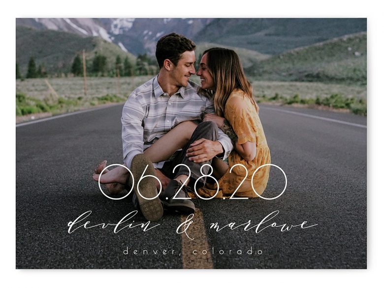full photo save the date with photo of couple in middle of the road