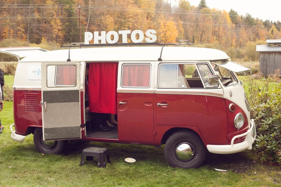 vintage red and white VW bus with "Photos" sign