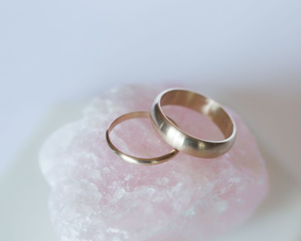 hand made wedding rings on a pink rock