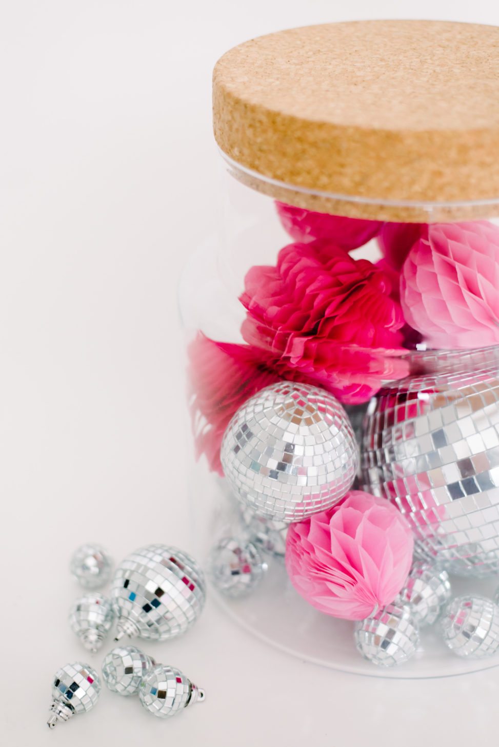 wedding party terrarium with pink and yellow mini pinatas and disco balls