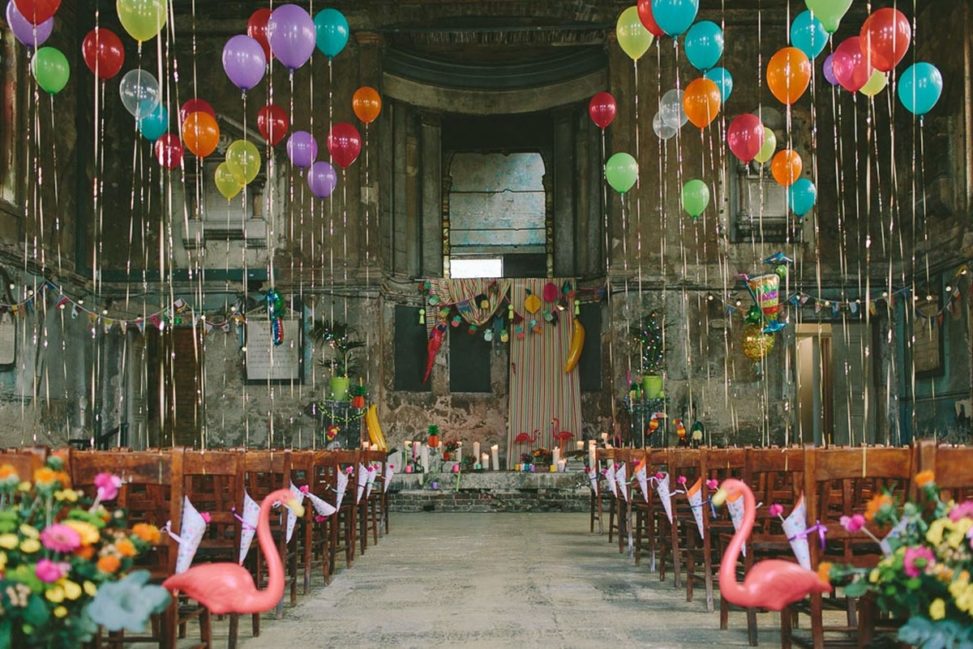warehouse decorated with balloons and flamingos
