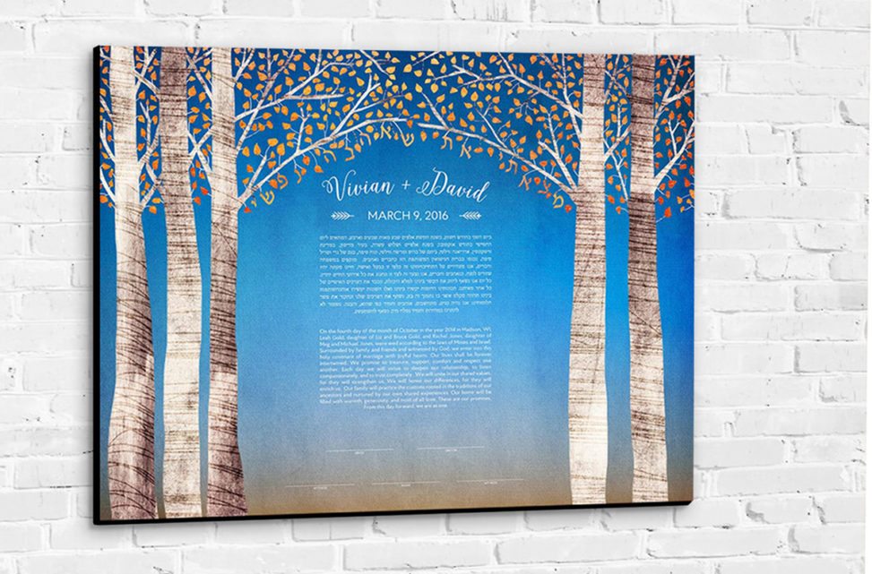 A colorful canvas ketubah with illustrated birch trees hanging on a wall