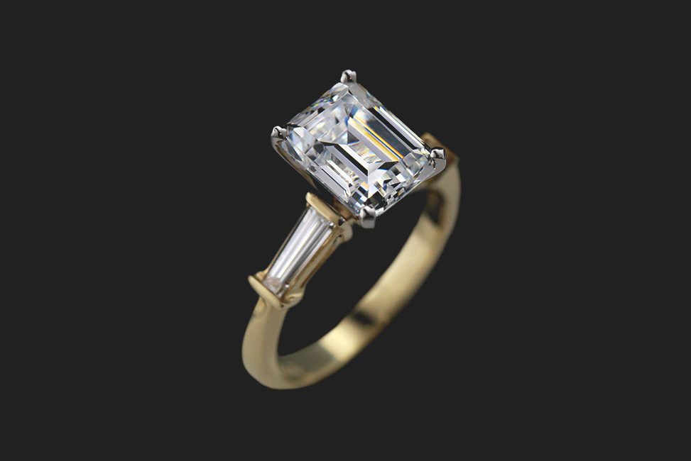 emerald cut ethical diamond engagement ring in gold band with baguette side stones