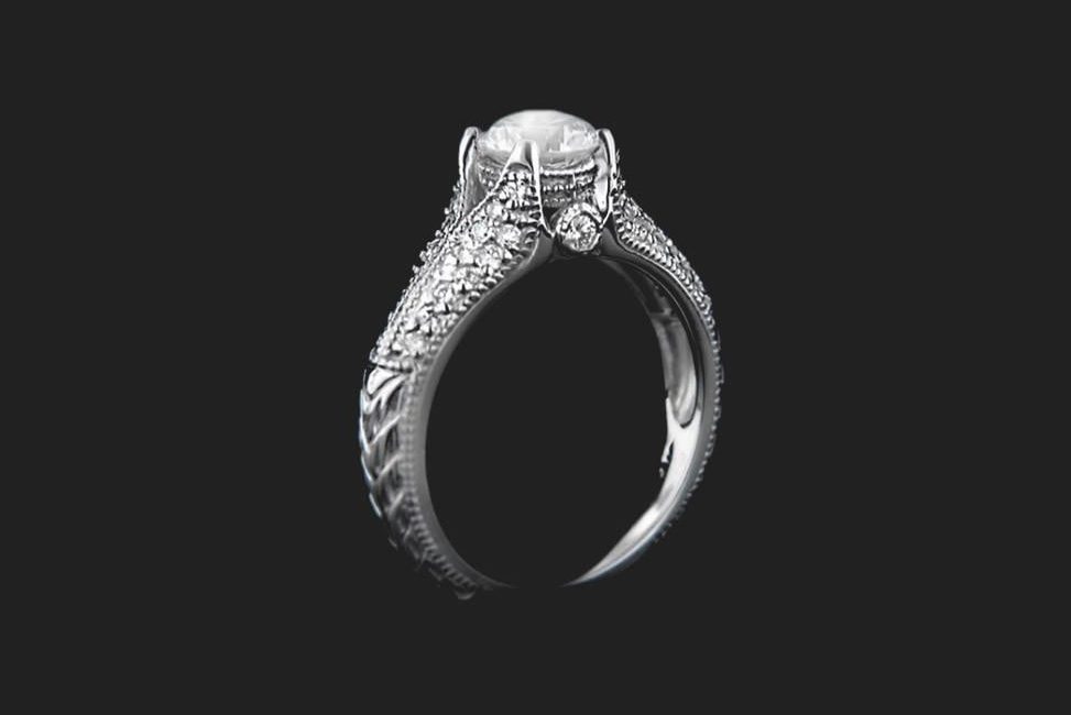 conflict free diamond engagement ring with intricate side stone details