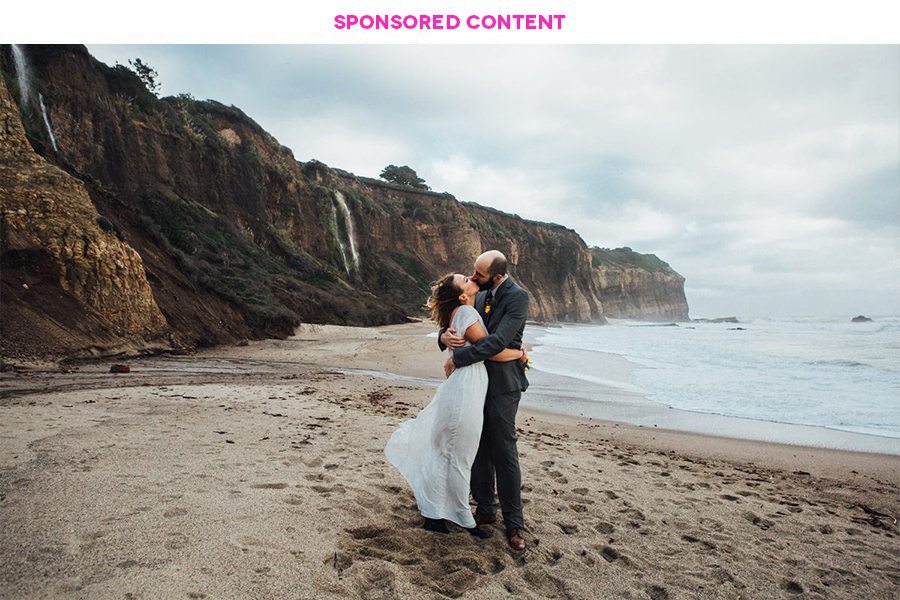 Couple in wedding clothes embracing on a beach