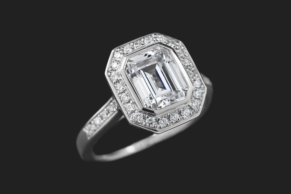 conflict free emerald cut diamond engagement ring in halo setting