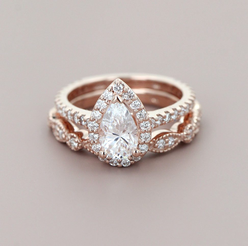 conflict-free pear shaped halo engagement ring and diamond wedding band from miadonna