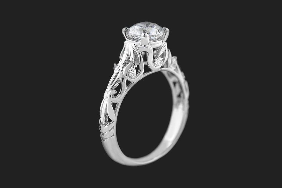 conflict free round diamond solitaire engagement ring with side scroll details
