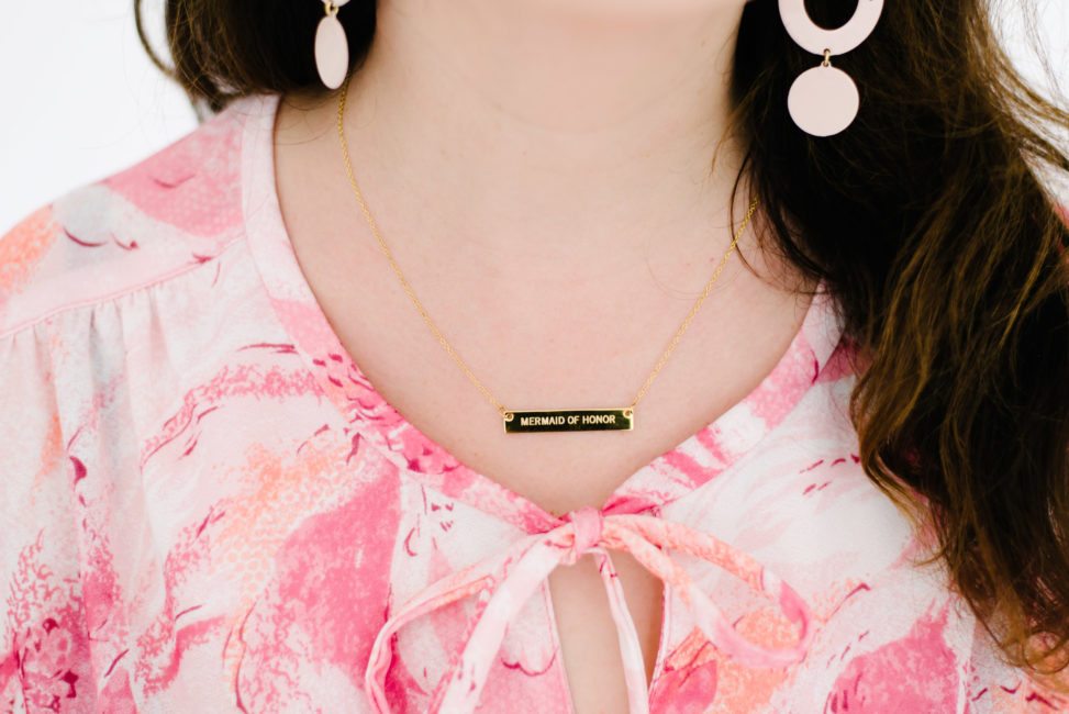 woman wearing engraved "mermaid of honor" necklace from Shutterfly 