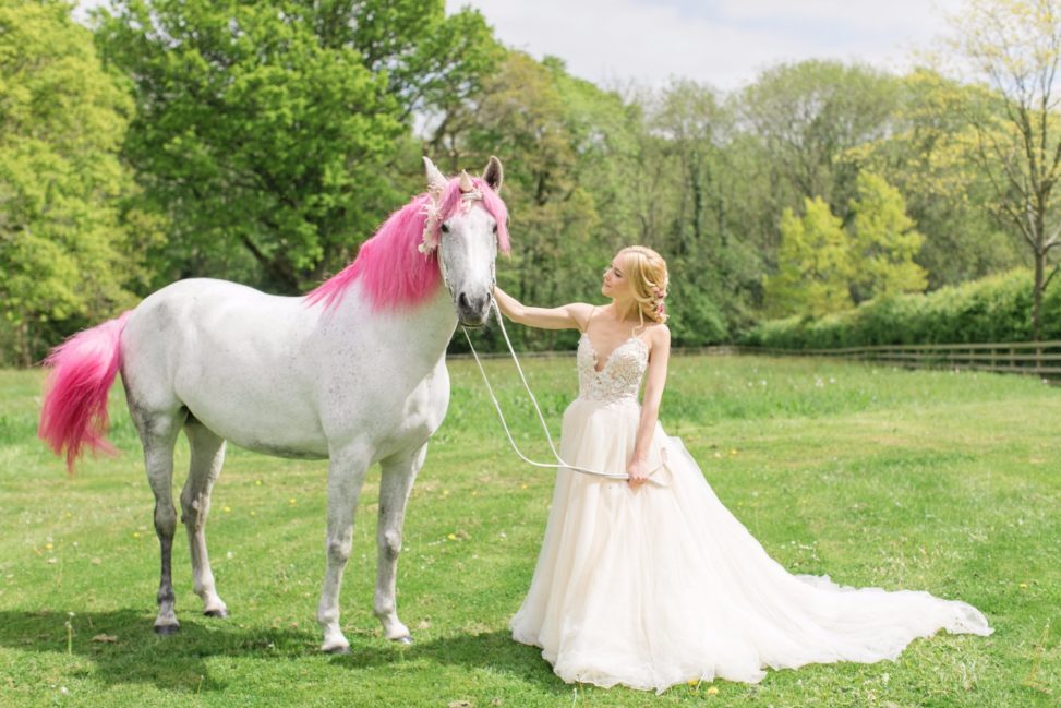 bride with a unicorn with pink hair