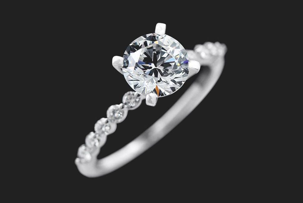 simple conflict free solitaire diamond engagement ring with unique band setting
