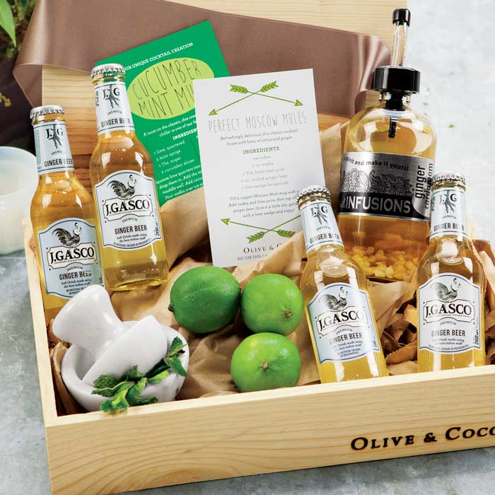 Wooden crate filled with bottles, papers and limes