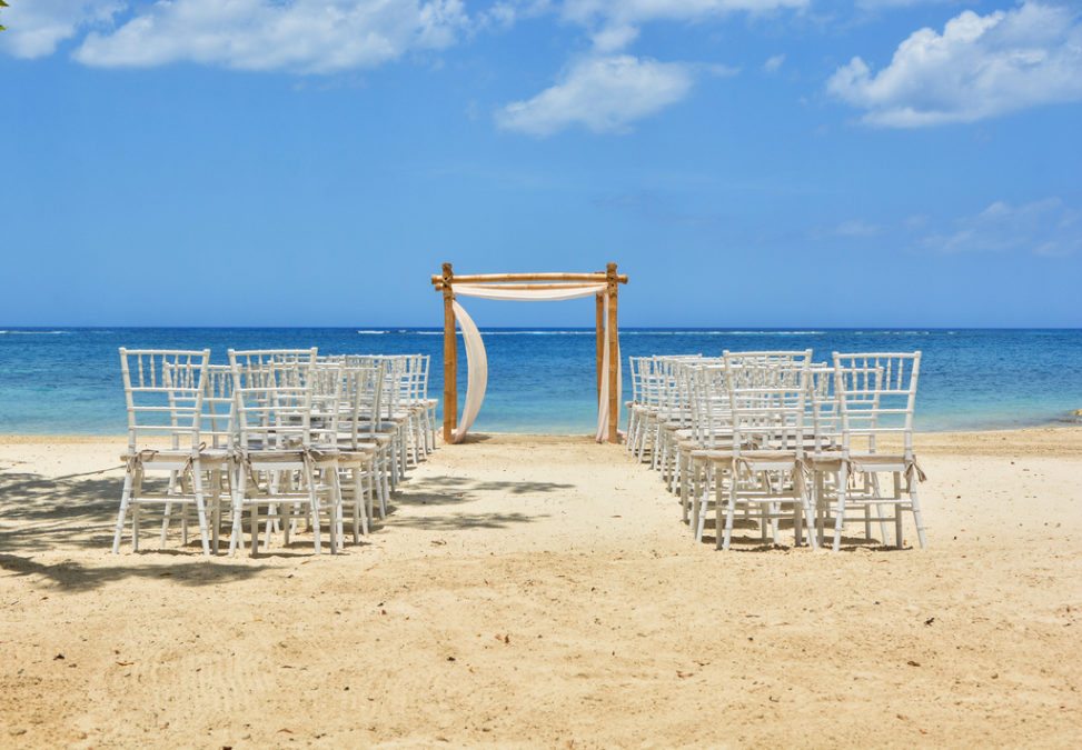 A wedding ceremony setup on the beach