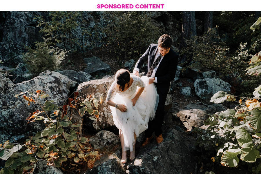Looking down on a couple in wedding clothes in a garden; text above the image reads "Sponsored Content"