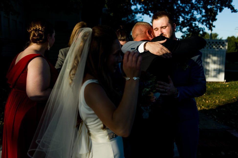 A wedding party hug and embrace