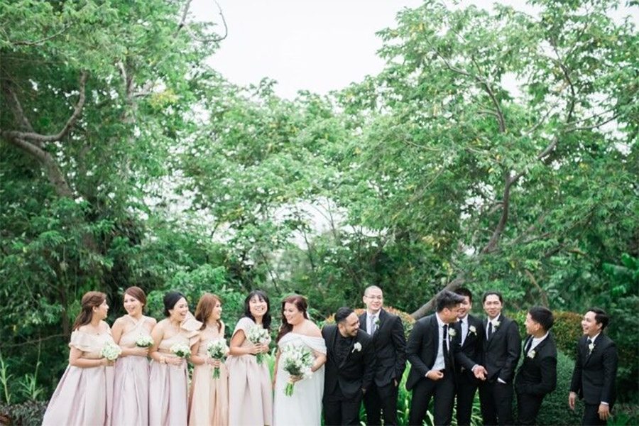 Wedding party lined up and laughing