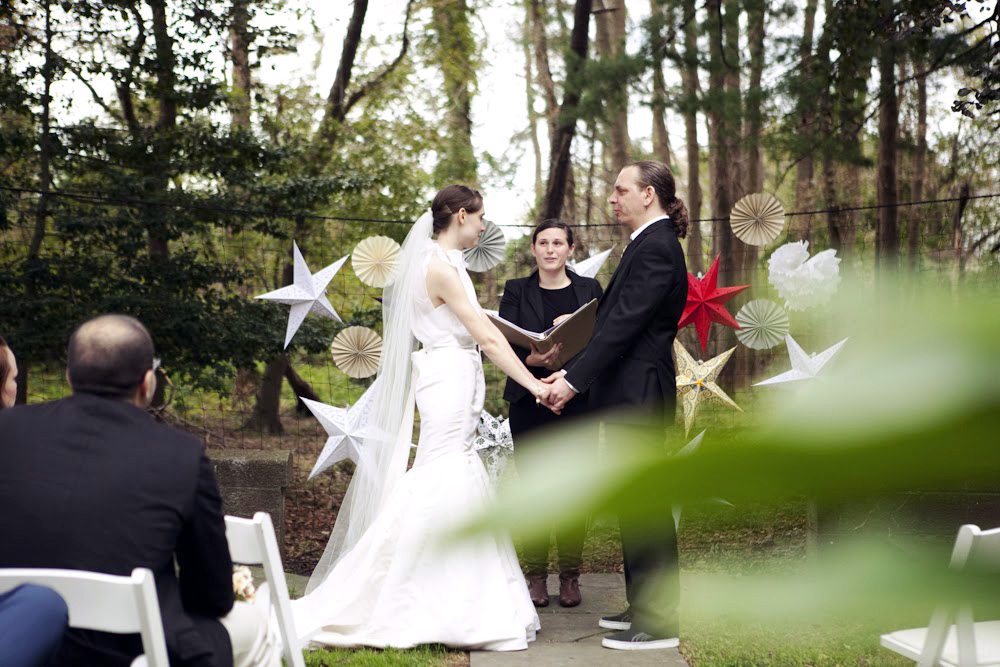 A wedding ceremony taking place in the woods and using a wedding ceremony script