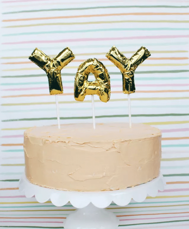 Gold Mylar balloon "yay" cake topper