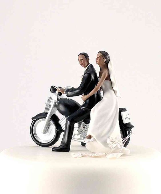 black bride and groom on a motorcycle wedding cake topper