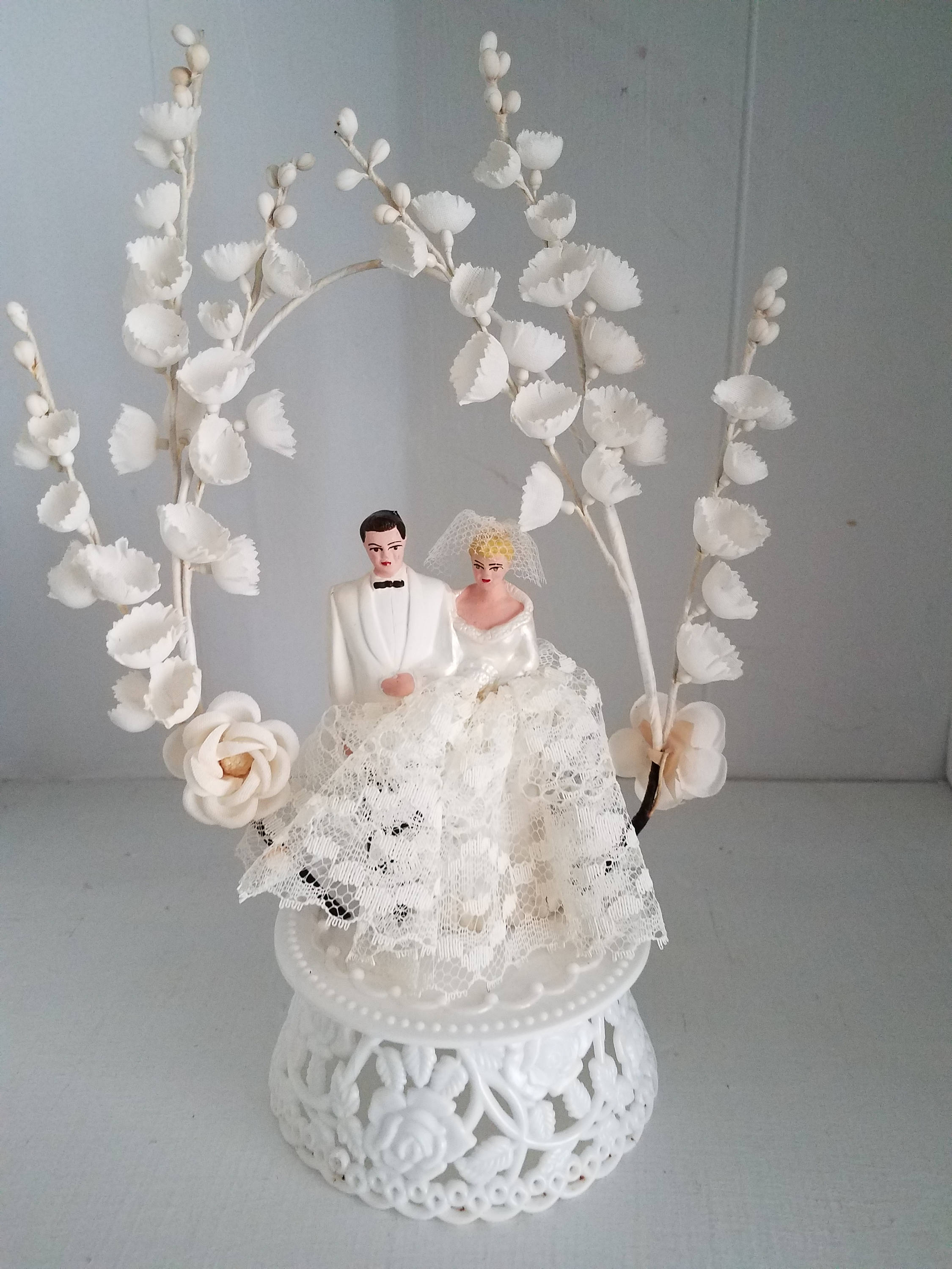 vintage cake topper with flowers and lace