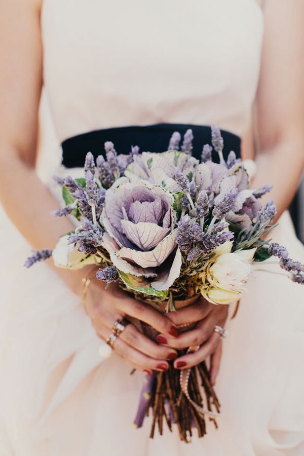 purple and white hand-tied bridal bouquet with ornamental cabbage and lavender