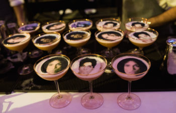 Close up of cocktail glasses with faces