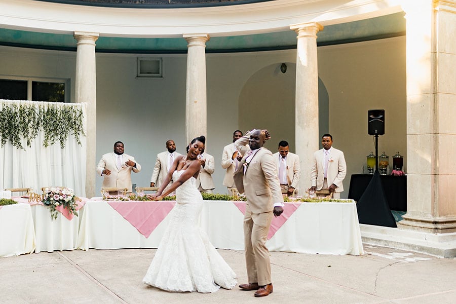 a bride and groom dance during their reception