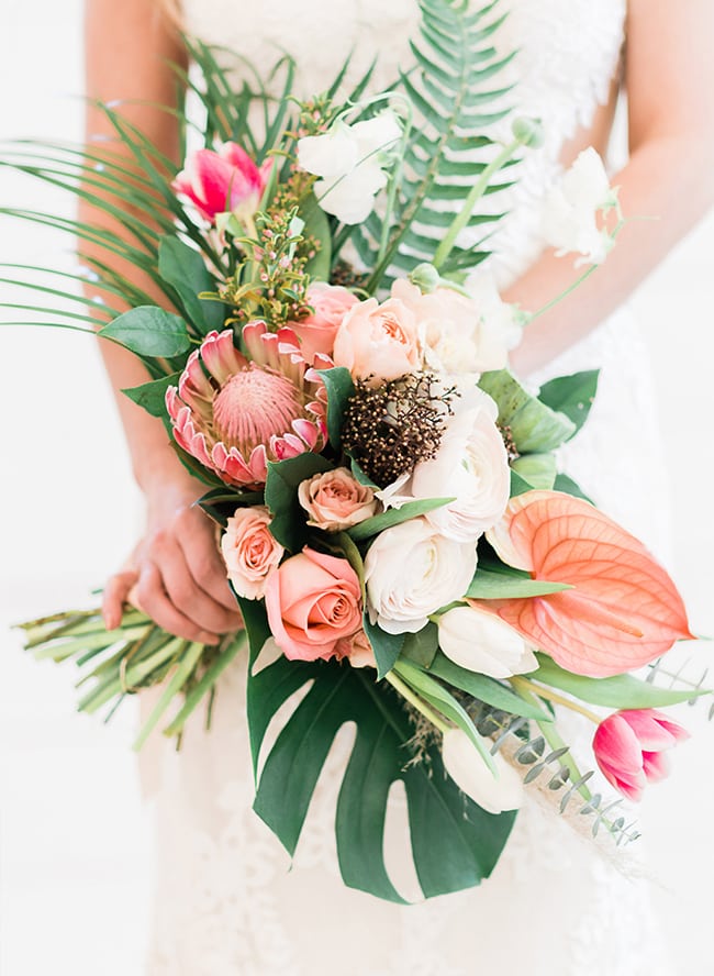 tropical asymmetrical bouquet with peach and white flowers