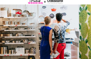 two women standing in front of a shelf of kitchenware at a crate and barrel LGBTQ wedding registry event