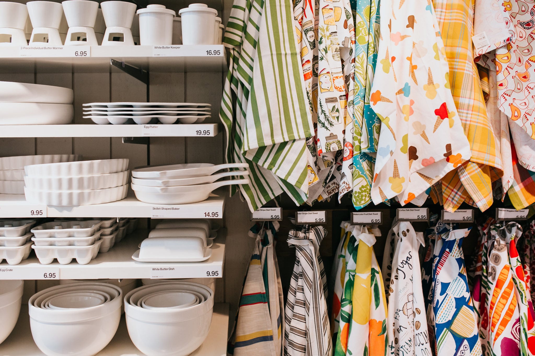kitchen towels and white glassware at a crate and barrel private registry event