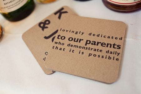 Cardboard coaster with words dedicating things to parents
