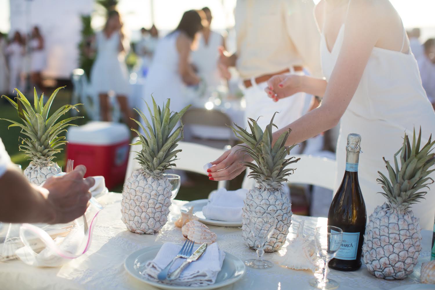 bridal shower ideas - Close up of a table with silver pineapple centerpieces 