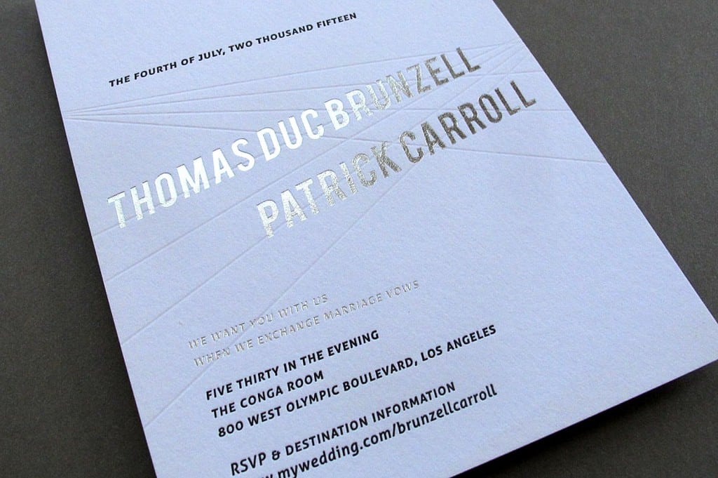 detail of letterpress invite with silver foil and graphic lines