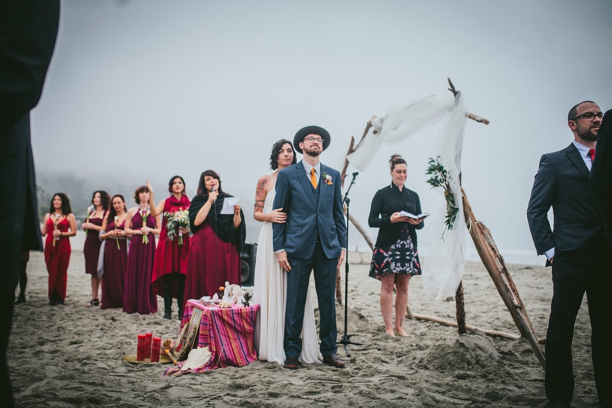 A wedding ceremony takes place, at the beach