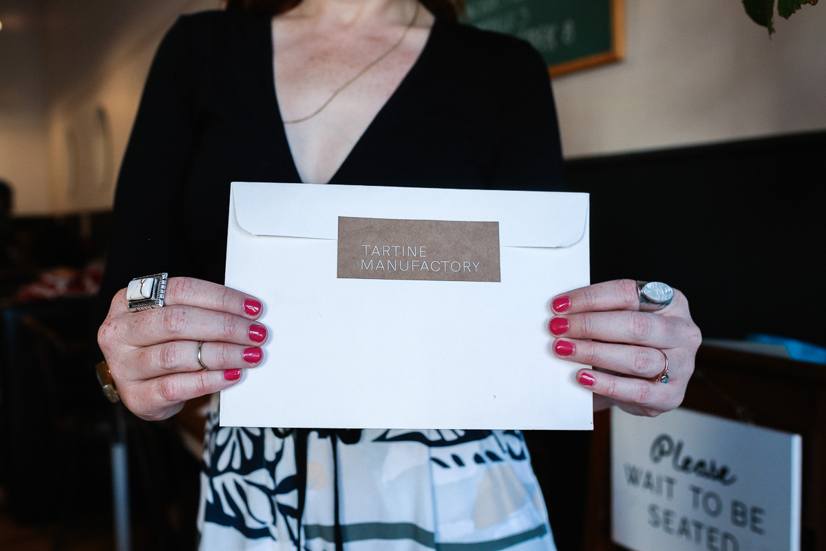 A woman holding an envelope