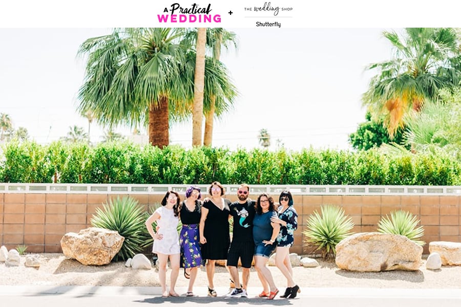A group of women stand posed in front of a palm tree and desert garden beneath the text A Practical Wedding + The Wedding Shop Shutterfly