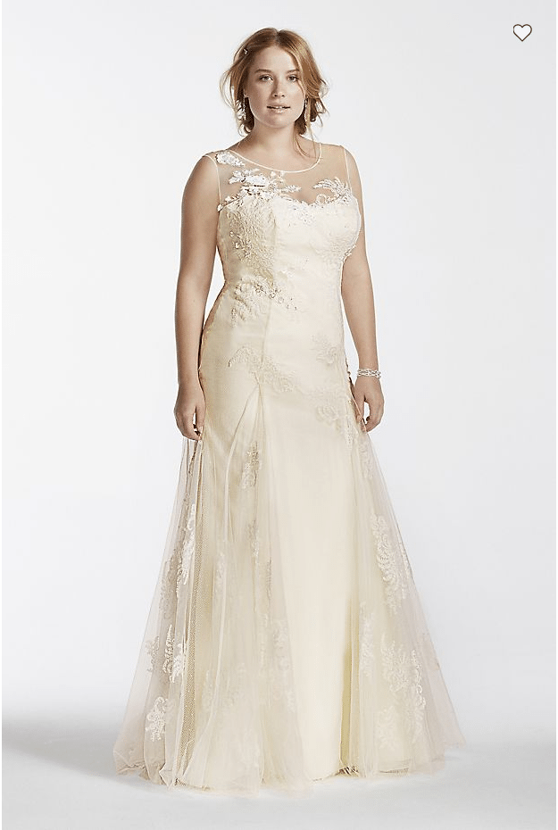 a woman wears an off-white strapless a-line dress with a sleeveless sheer embroidered overlay