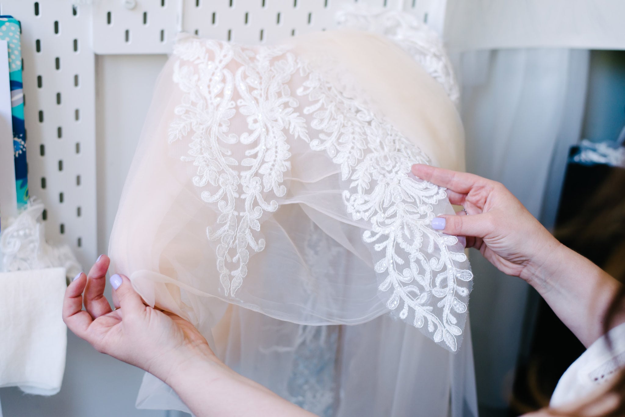 A person holds some wedding lace