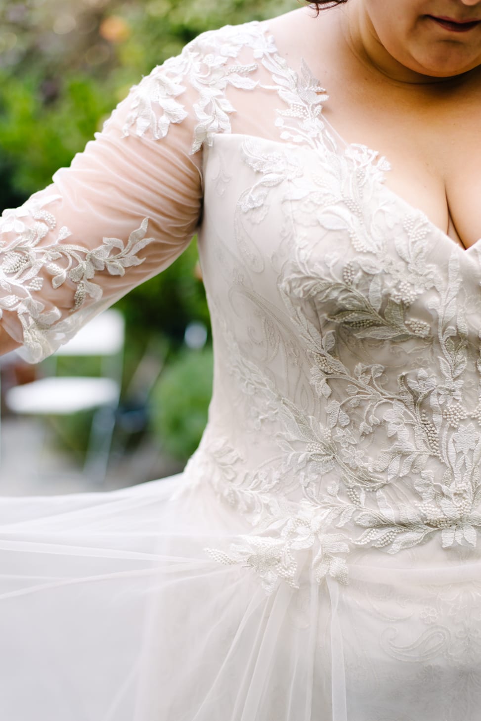 close up photo of plus size wedding dress sleeve floral lace details from Lace and Liberty