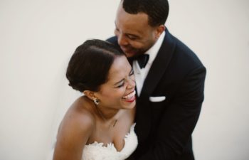 A bride and groom laugh in this photo by Sarah Gormley