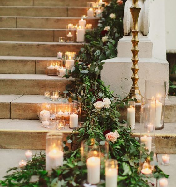 Candles and fir trimmings going down a staircase