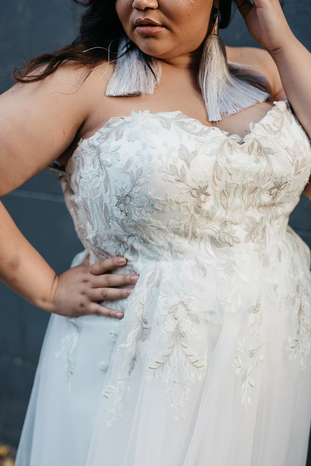 close up of strapless vintage inspired colored lace plus size wedding gown from the a practical wedding plus size wedding dress collection