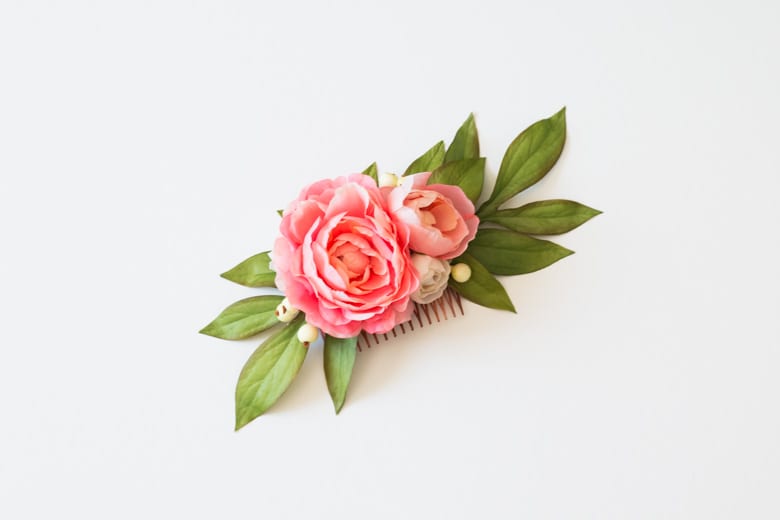 wedding ideas for hair accessories—a hair comb with pink flowers