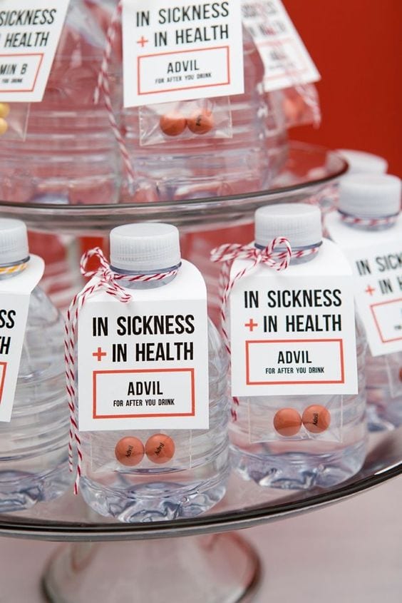 wedding ideas for a hangover kit—advil and water bottles with a sign that reads "in sickness + in health. Advil for after you drink"